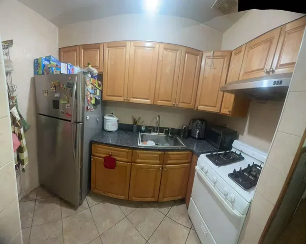 a room with wooden floor and furniture