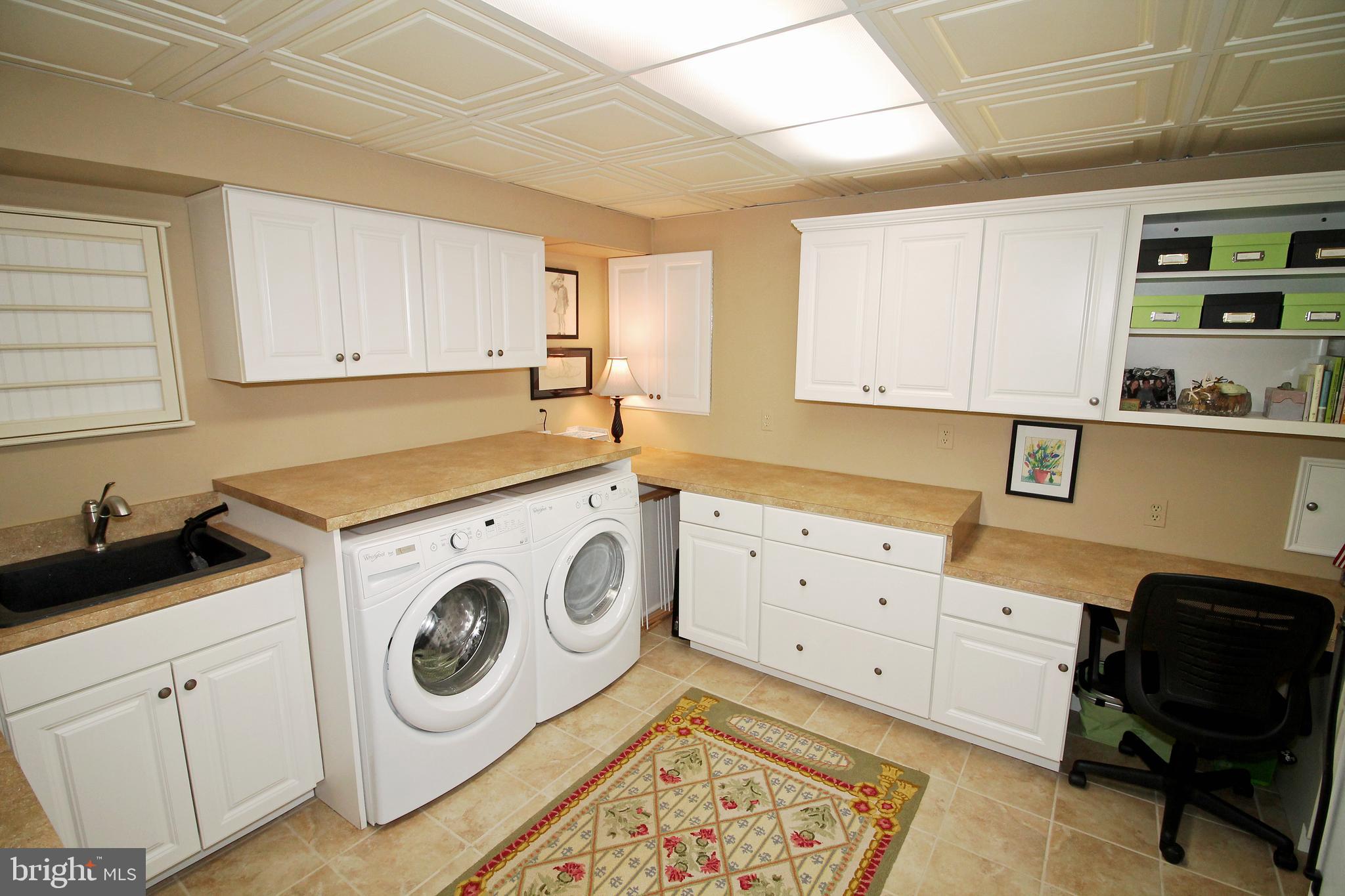 1003 Valewood Road Towson, MD 21286 - Photo 39 of 53 Craft room/laundry room-front loading washer/dryer