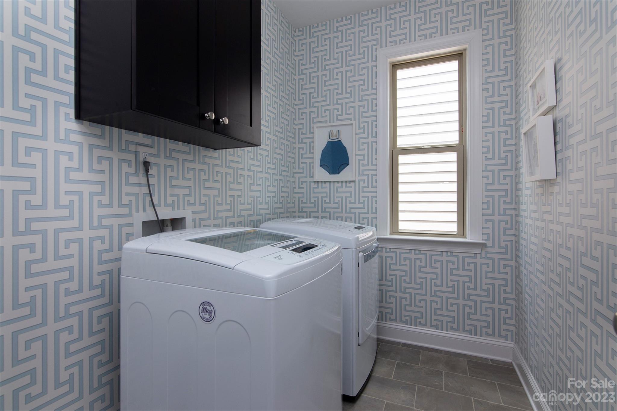 15111 Rocky Bluff Loop Davidson, NC 28036 - Photo 22 of 24 a utility room with dryer and washer