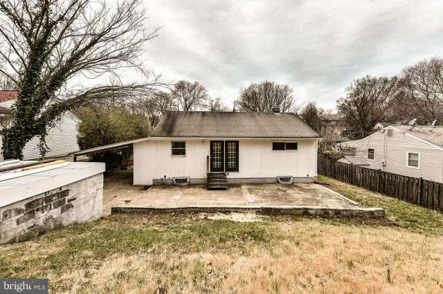 a view of a house with a snow in the yard