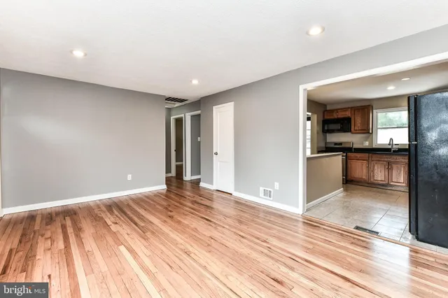a view of a livingroom with wooden floor