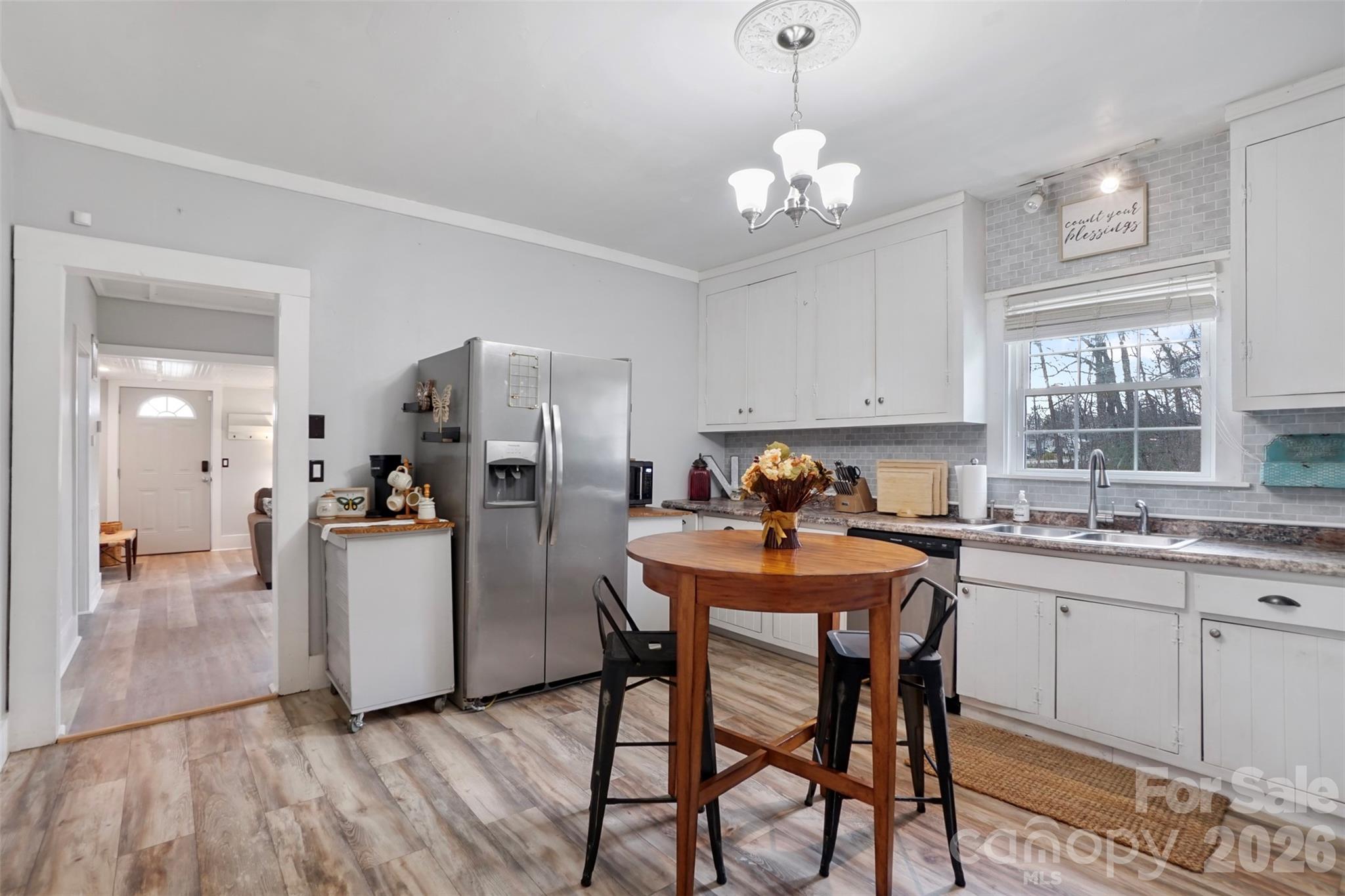 409 Blacksnake Road Stanley, NC 28164 - Photo 15 of 28 a kitchen that has a table and chairs in it
