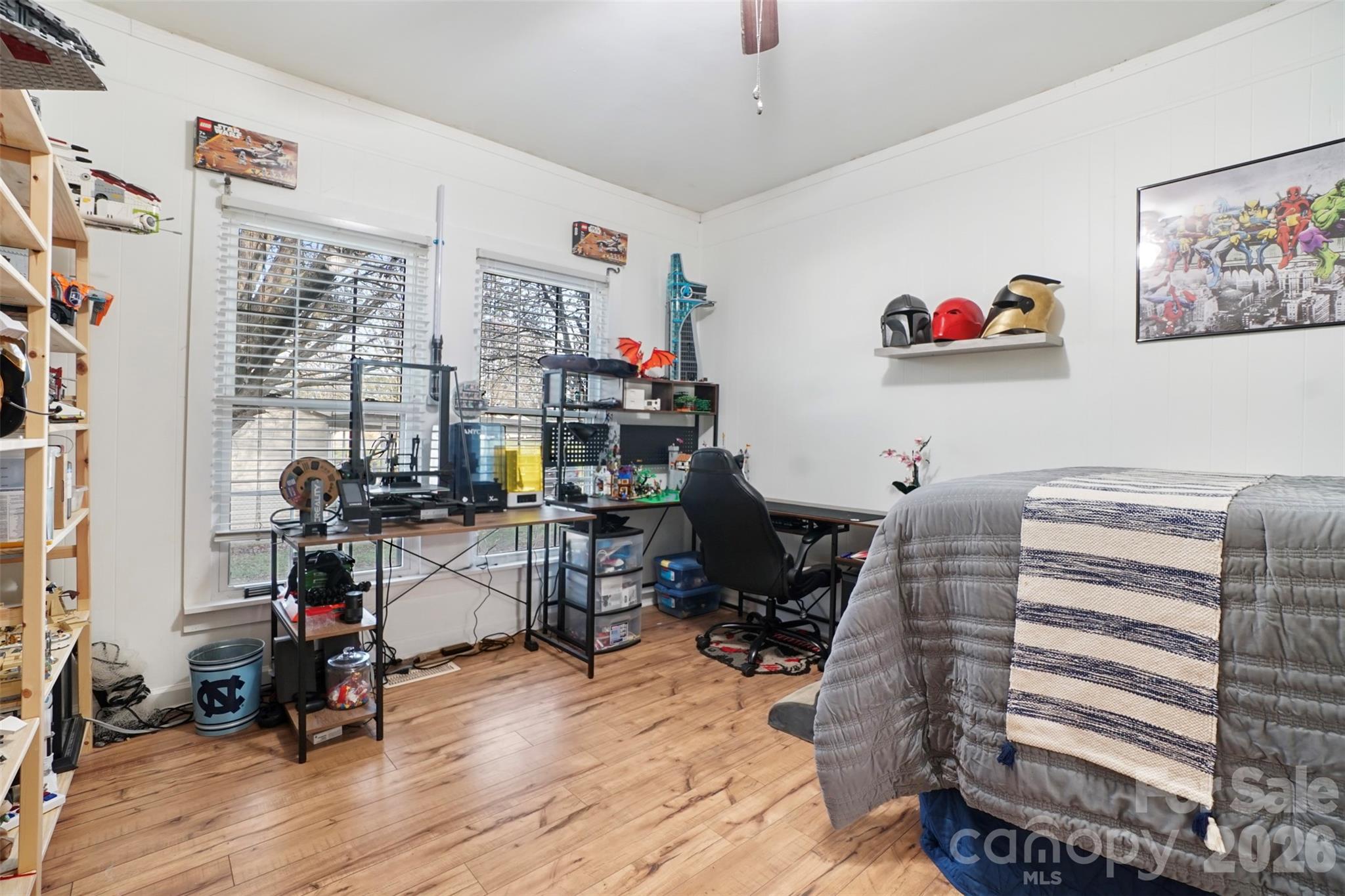 409 Blacksnake Road Stanley, NC 28164 - Photo 19 of 28 a bedroom with furniture and wooden floor