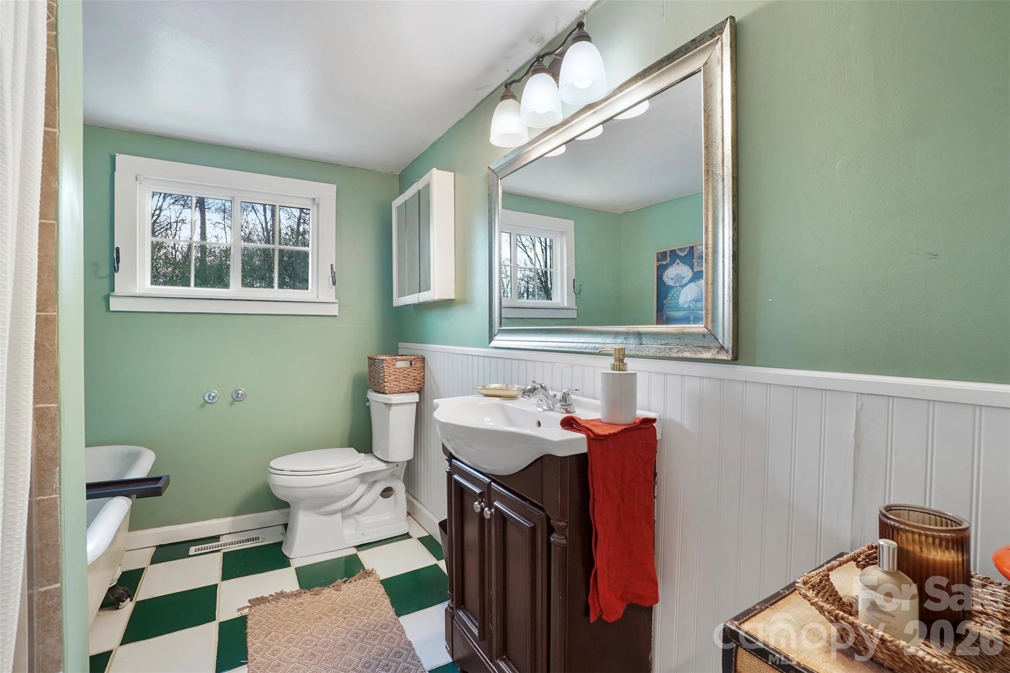 409 Blacksnake Road Stanley, NC 28164 - Photo 21 of 28 a bathroom with a sink a toilet and a mirror