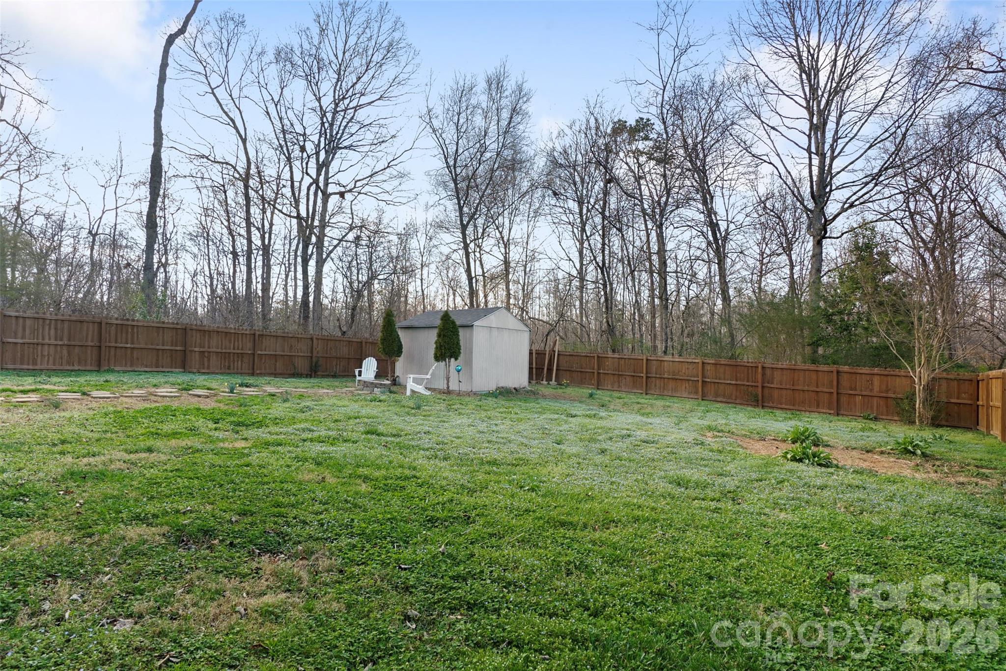 409 Blacksnake Road Stanley, NC 28164 - Photo 23 of 28 a backyard of a house with lots of green space