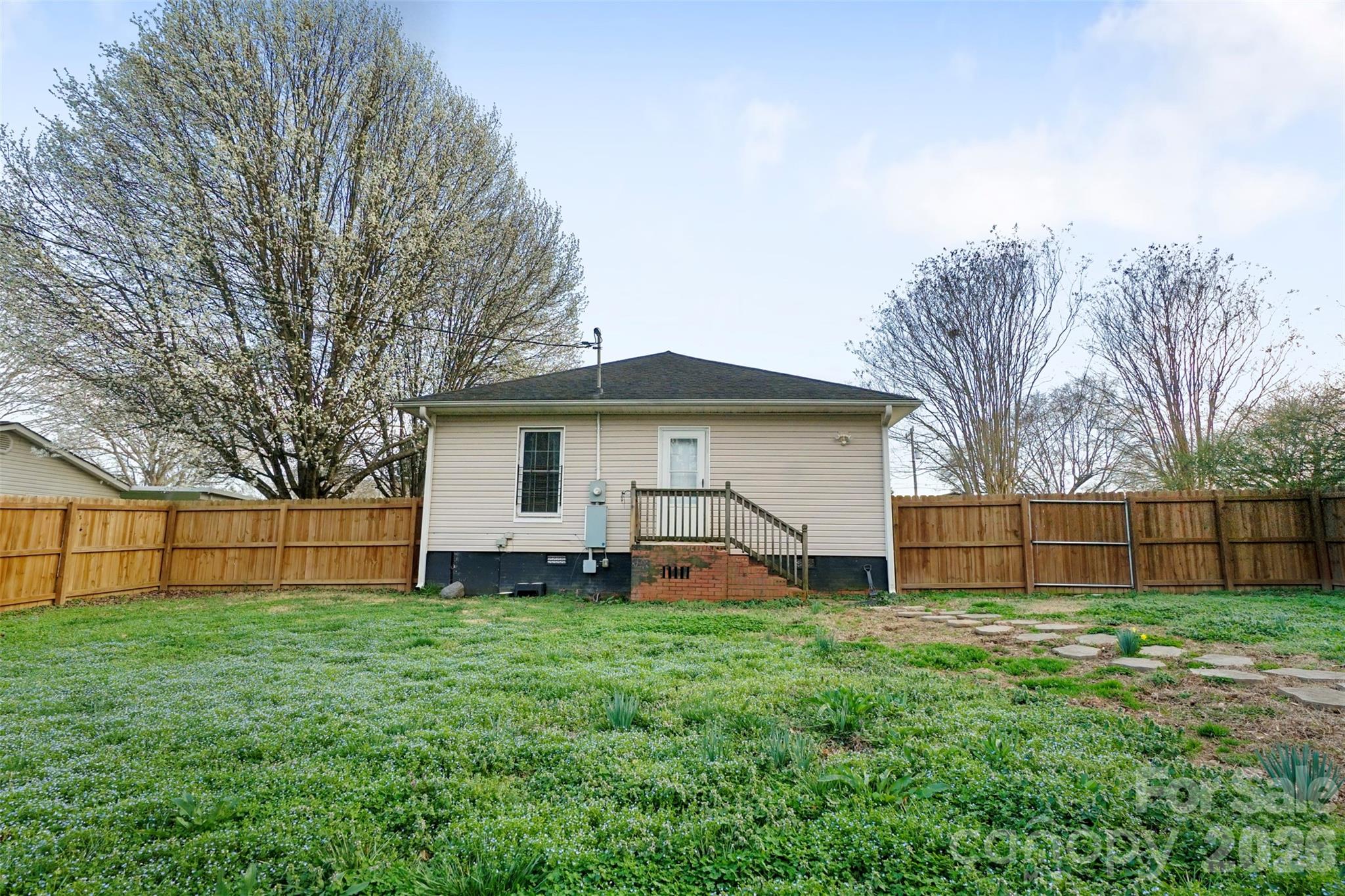 409 Blacksnake Road Stanley, NC 28164 - Photo 26 of 28 a view of a house with a yard