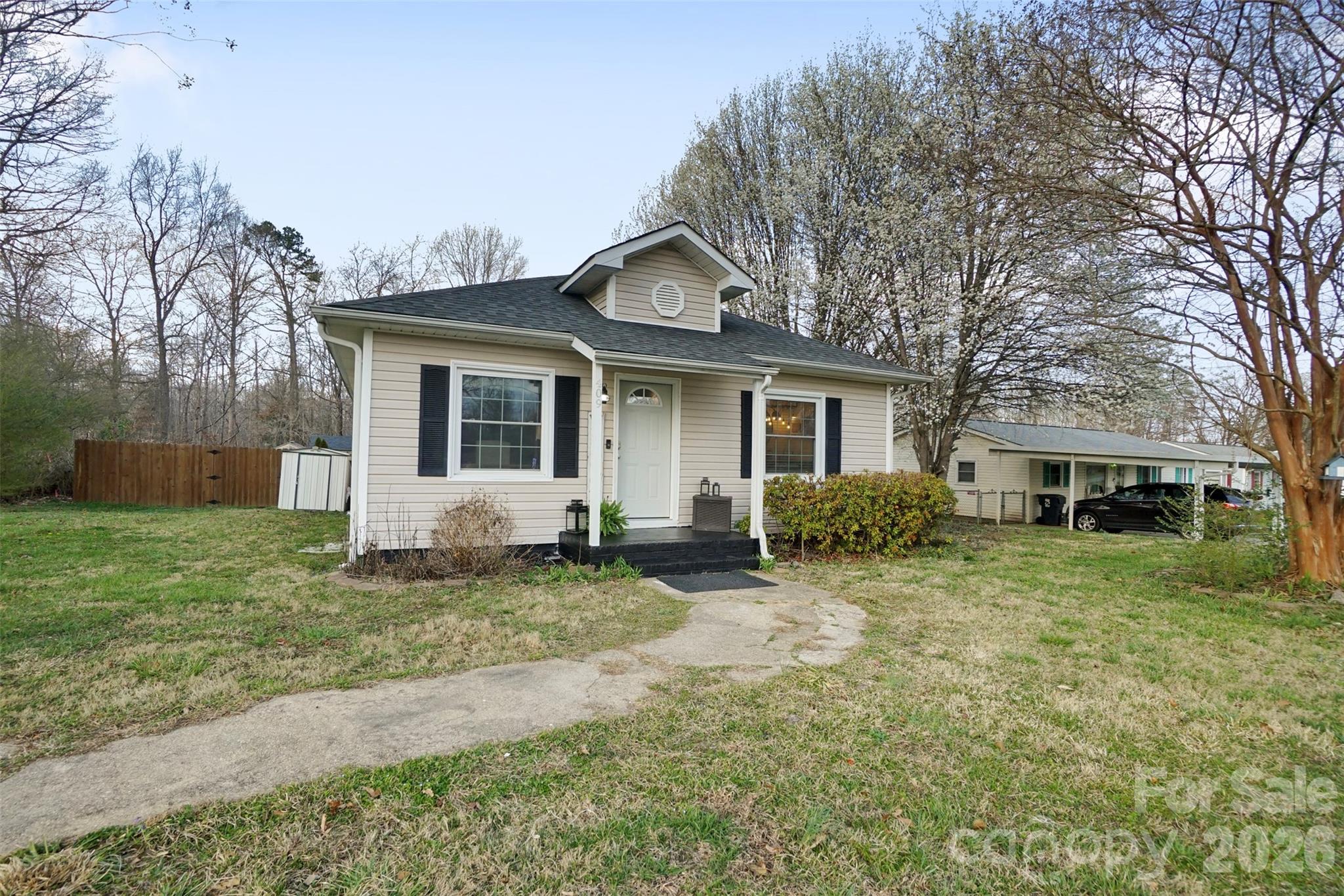 409 Blacksnake Road Stanley, NC 28164 - Photo 4 of 28 a house view with a garden space