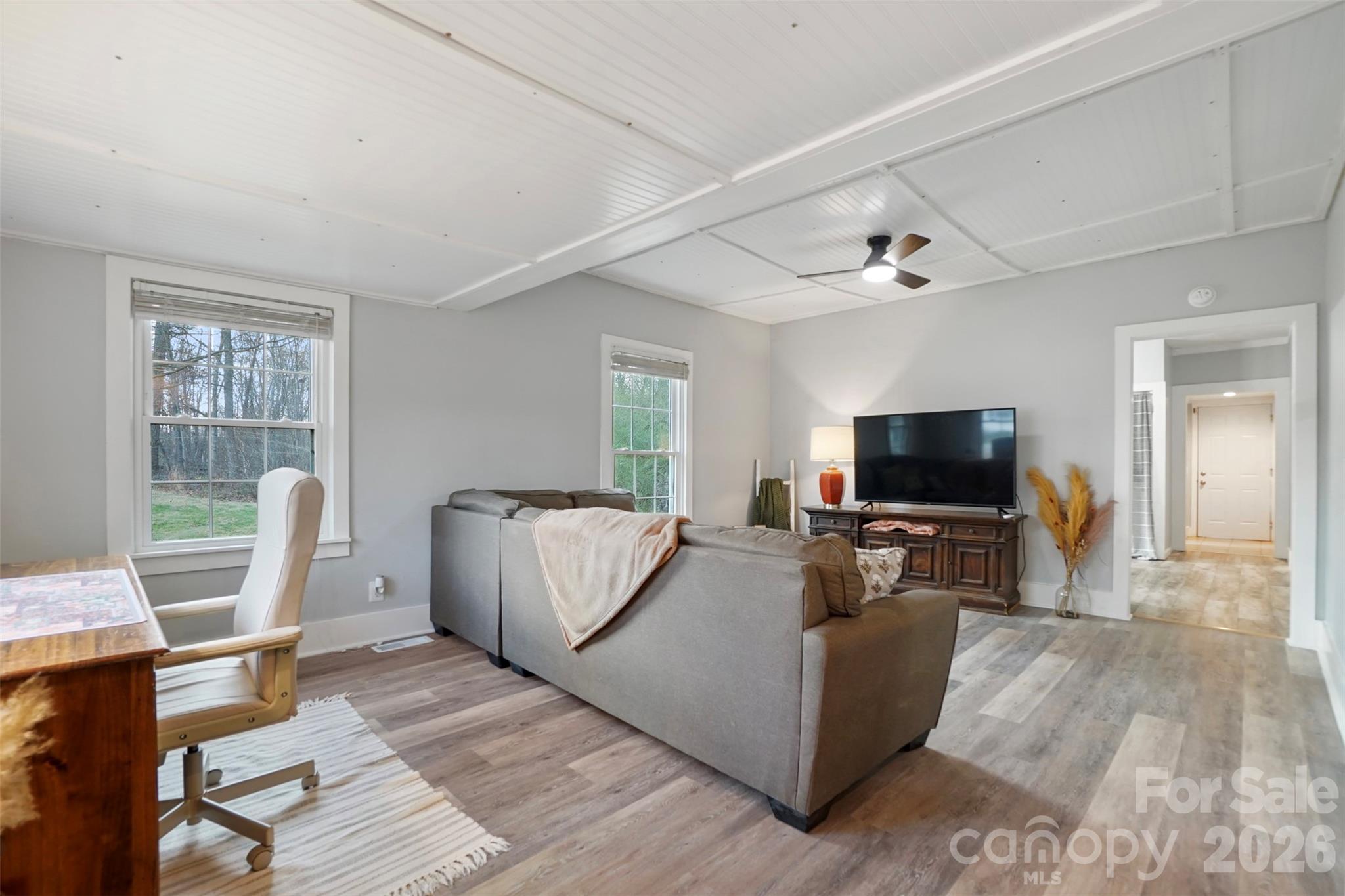 409 Blacksnake Road Stanley, NC 28164 - Photo 6 of 28 a living room with furniture and a flat screen tv