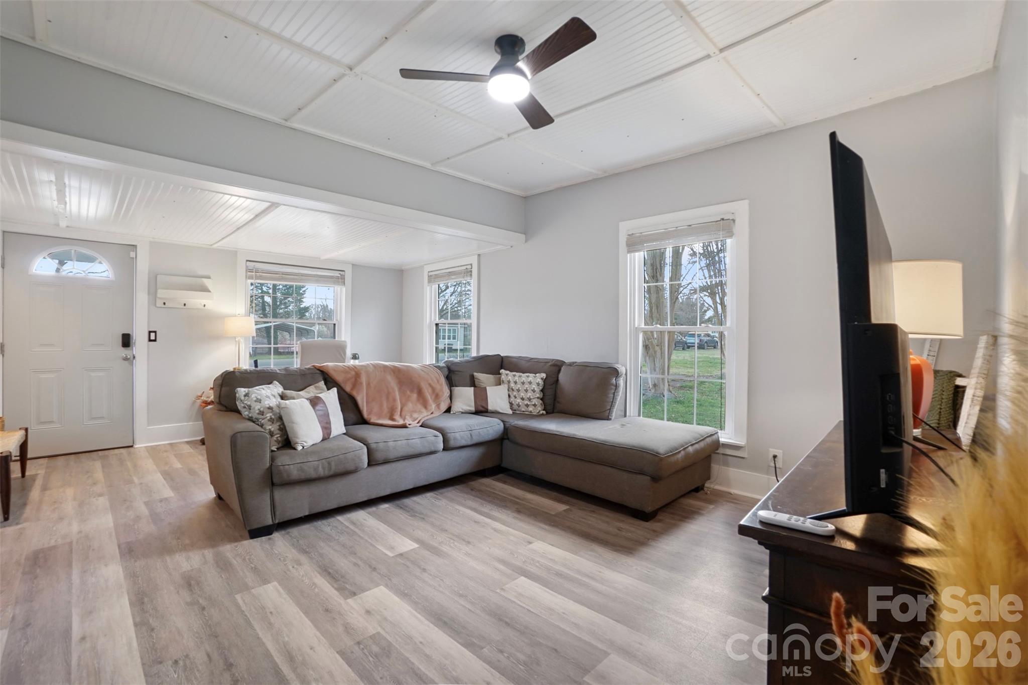 409 Blacksnake Road Stanley, NC 28164 - Photo 9 of 28 a living room with furniture flat screen tv and a window