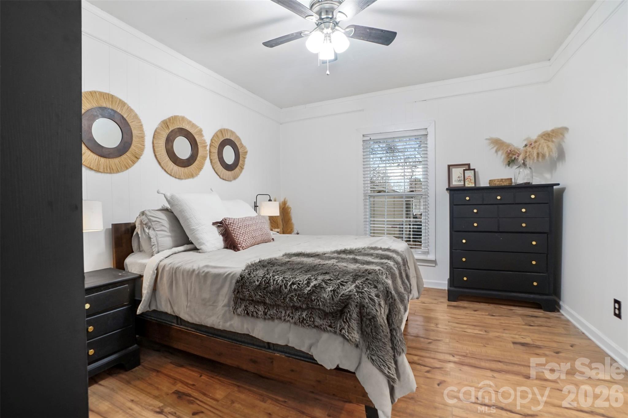 409 Blacksnake Road Stanley, NC 28164 - Photo 10 of 28 a bedroom with a bed and cabinets