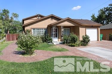 1330 Kirman Avenue Reno, NV 89502 - Photo 1 of 1 a front view of a house with a yard and porch