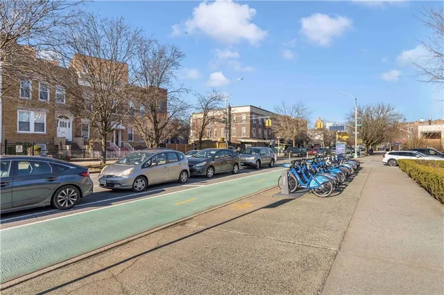 a view of a street with cars