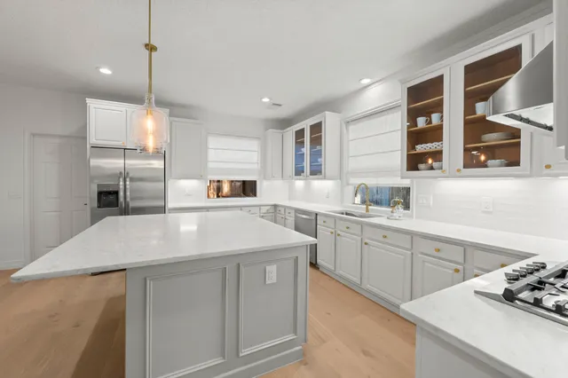 an empty room with windows and entrance