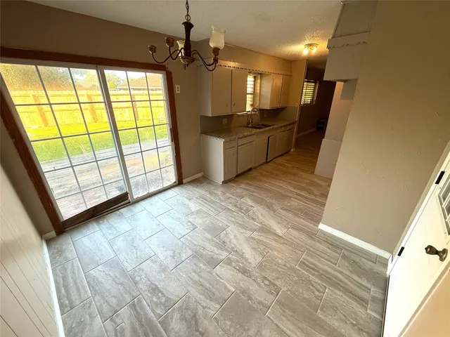 a view of a kitchen with a sink