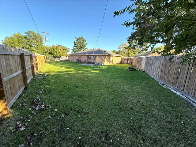 a view of a tiny house with a yard