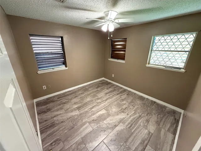 a view of empty room with windows