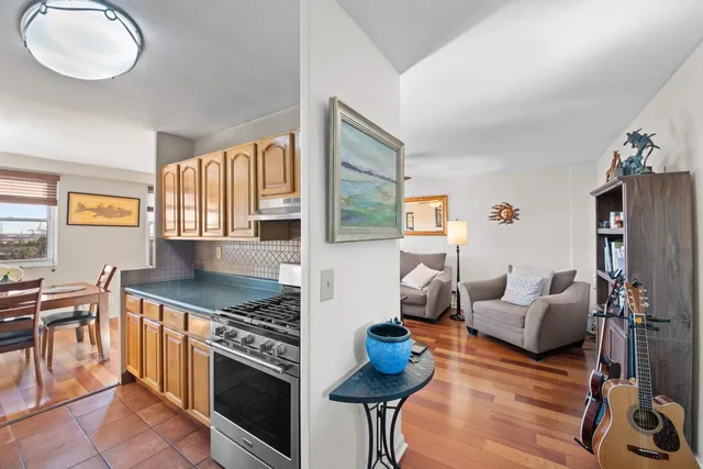 a kitchen with stainless steel appliances granite countertop a stove and a sink