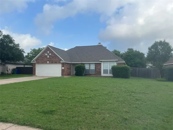 a front view of a house with yard