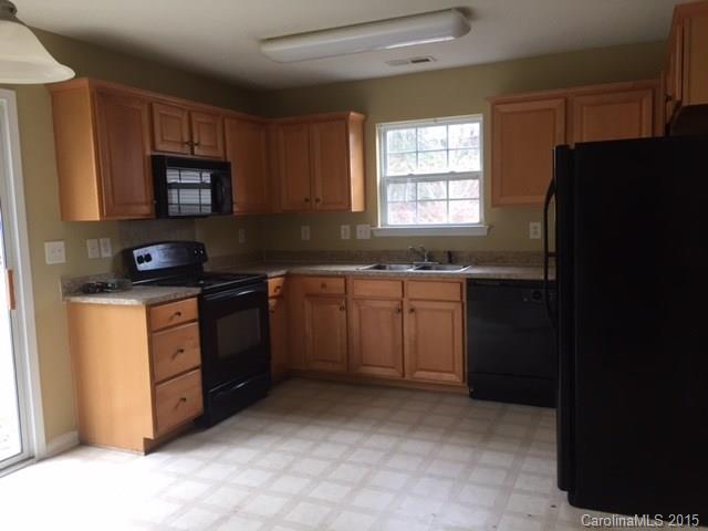 7800 Rabbits Foot Lane Charlotte, NC 28217 - Photo 3 of 9 a kitchen with a sink stove and microwave