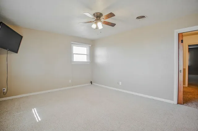 a bathroom with a sink toilet and mirror