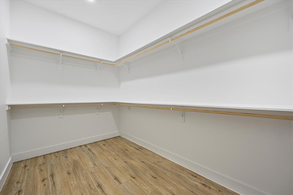2811 Rodeo Drive Quinlan, TX 75474 - Photo 14 of 35 Walk in closet featuring light wood-type flooring