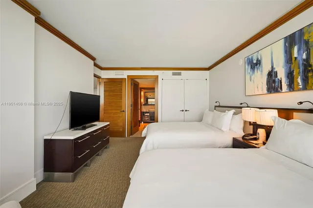 a bathroom with a shower and a sink