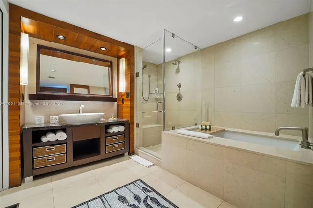 a bedroom with a bed and large windows