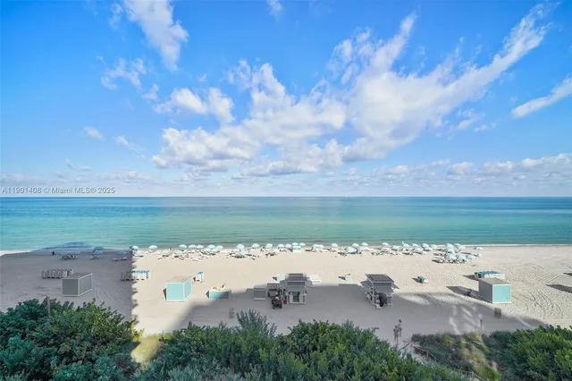 a en suite bathroom with a granite countertop sink and a mirror