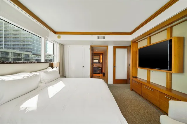 a bathroom with a sink a mirror and a shower