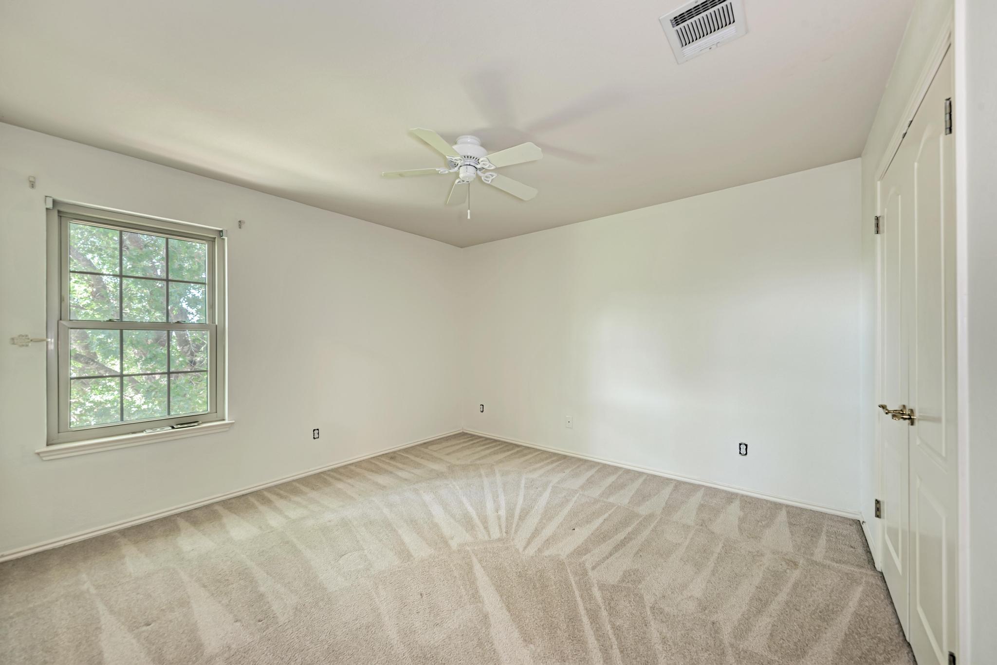 906 Antelope Ridge Cedar Park, TX 78613 - Photo 30 of 40 Plush carpeting and a multi-lite window define this comfortable second-floor bedroom.