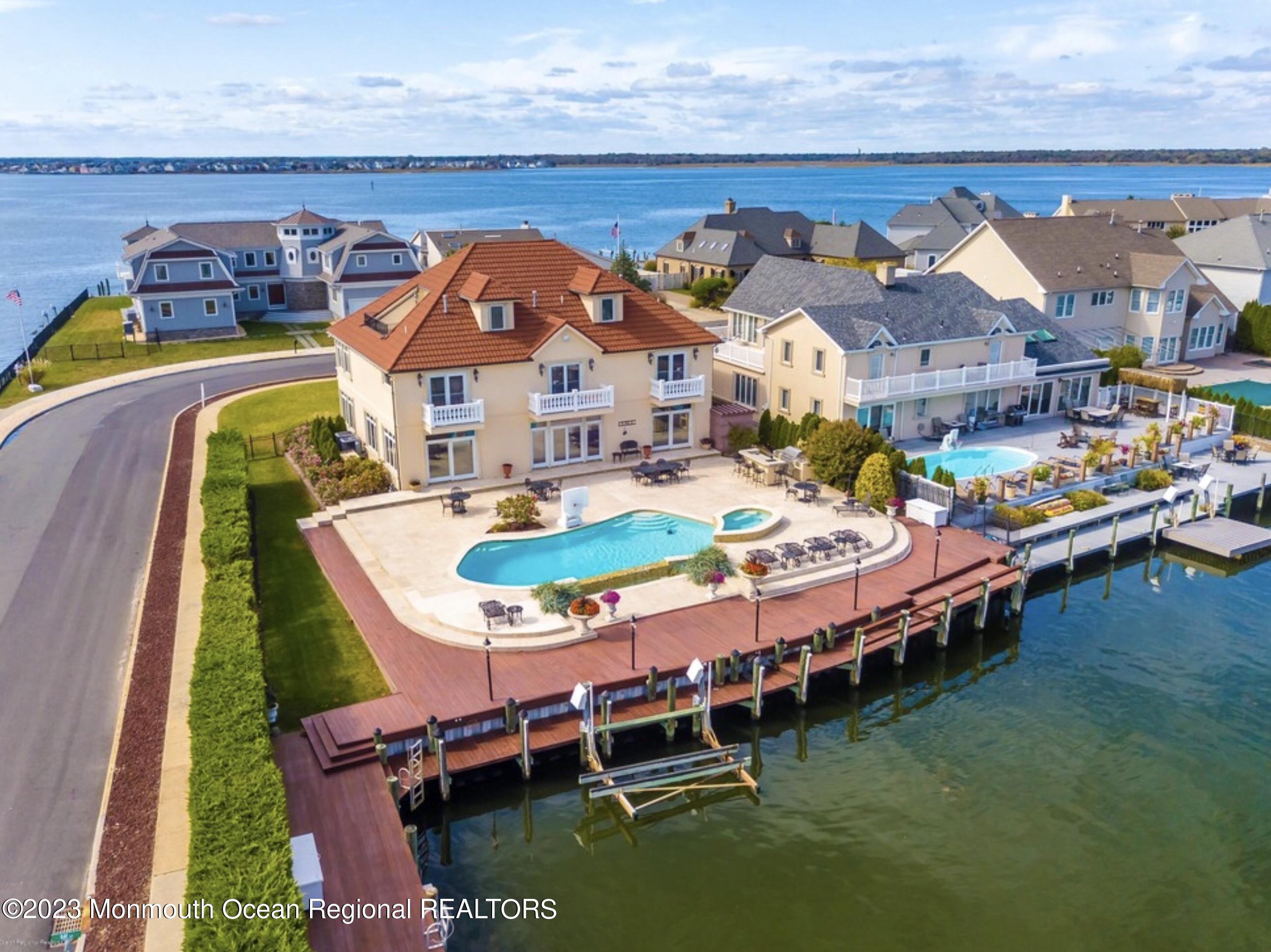 a swimming pool with outdoor seating and yard