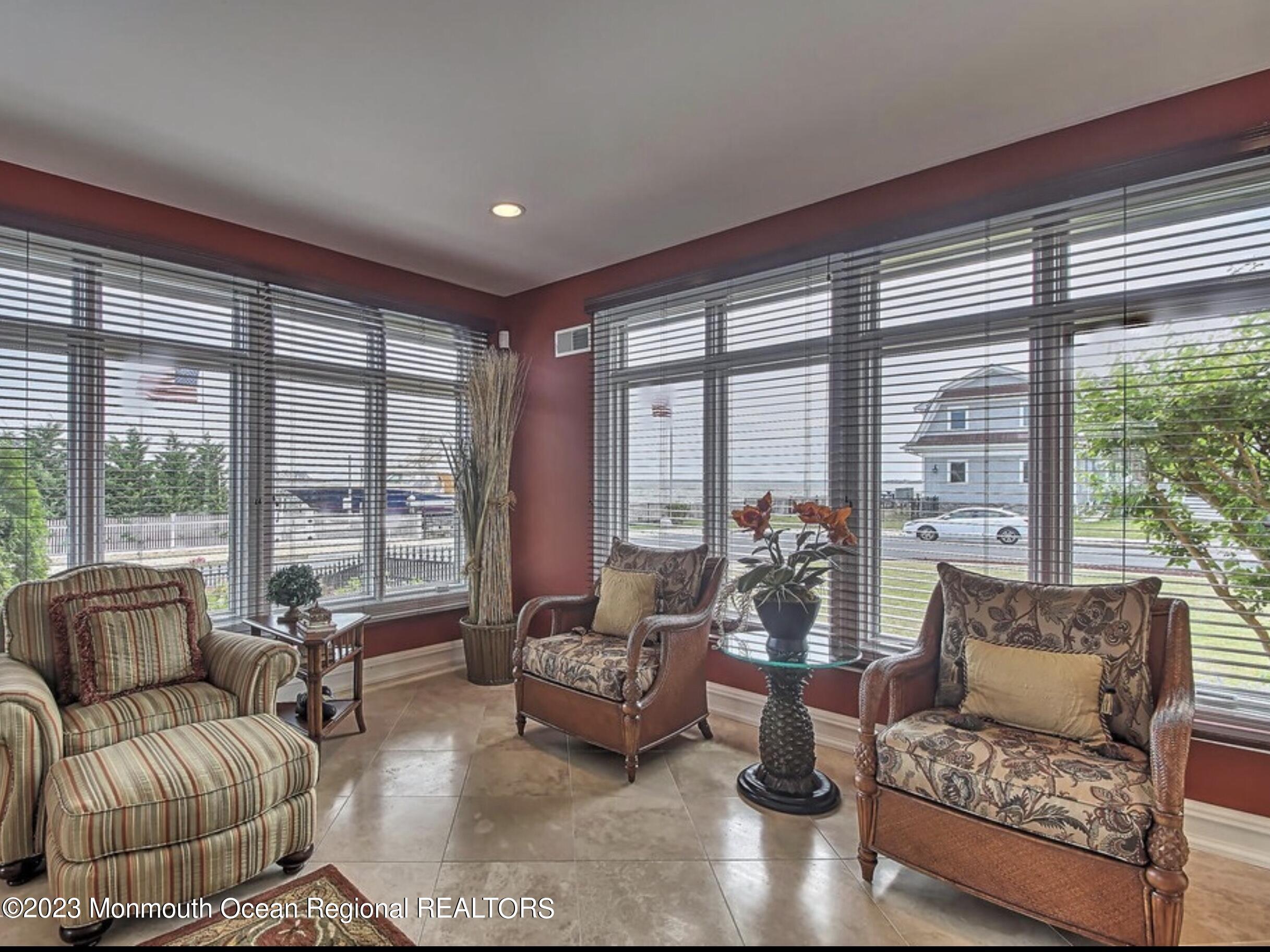 220 Pointe Drive Mantoloking, NJ 08738 - Photo 11 of 30 a living room with furniture and a large window