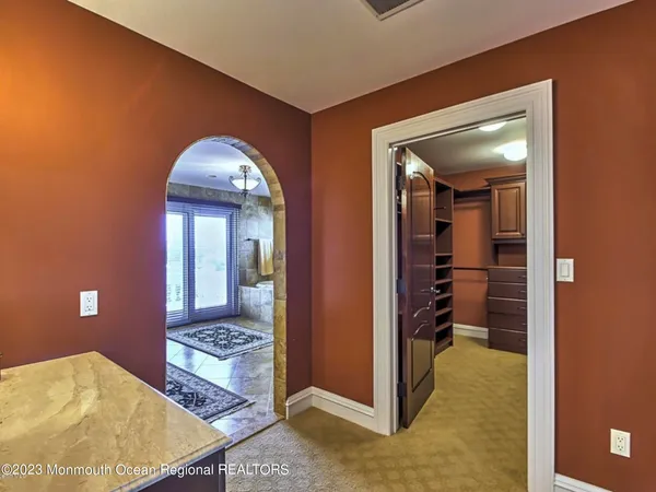 a bed room with a bed and a ceiling fan