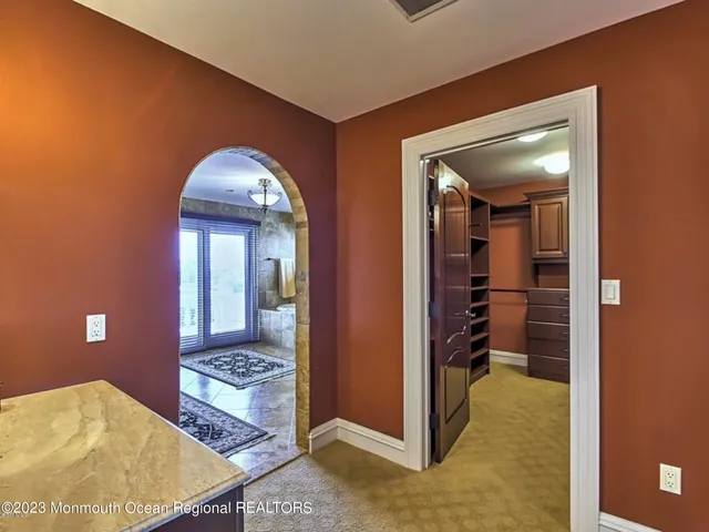 a bed room with a bed and a ceiling fan