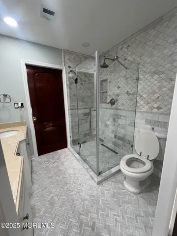 a bedroom with a large bed and a large window