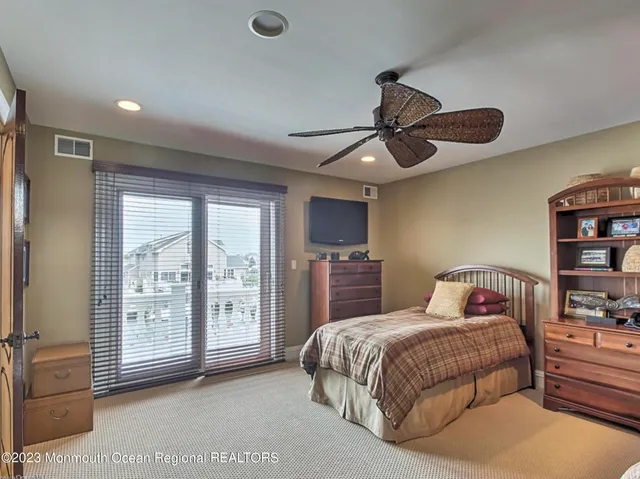 a bedroom with a bed and a lamp