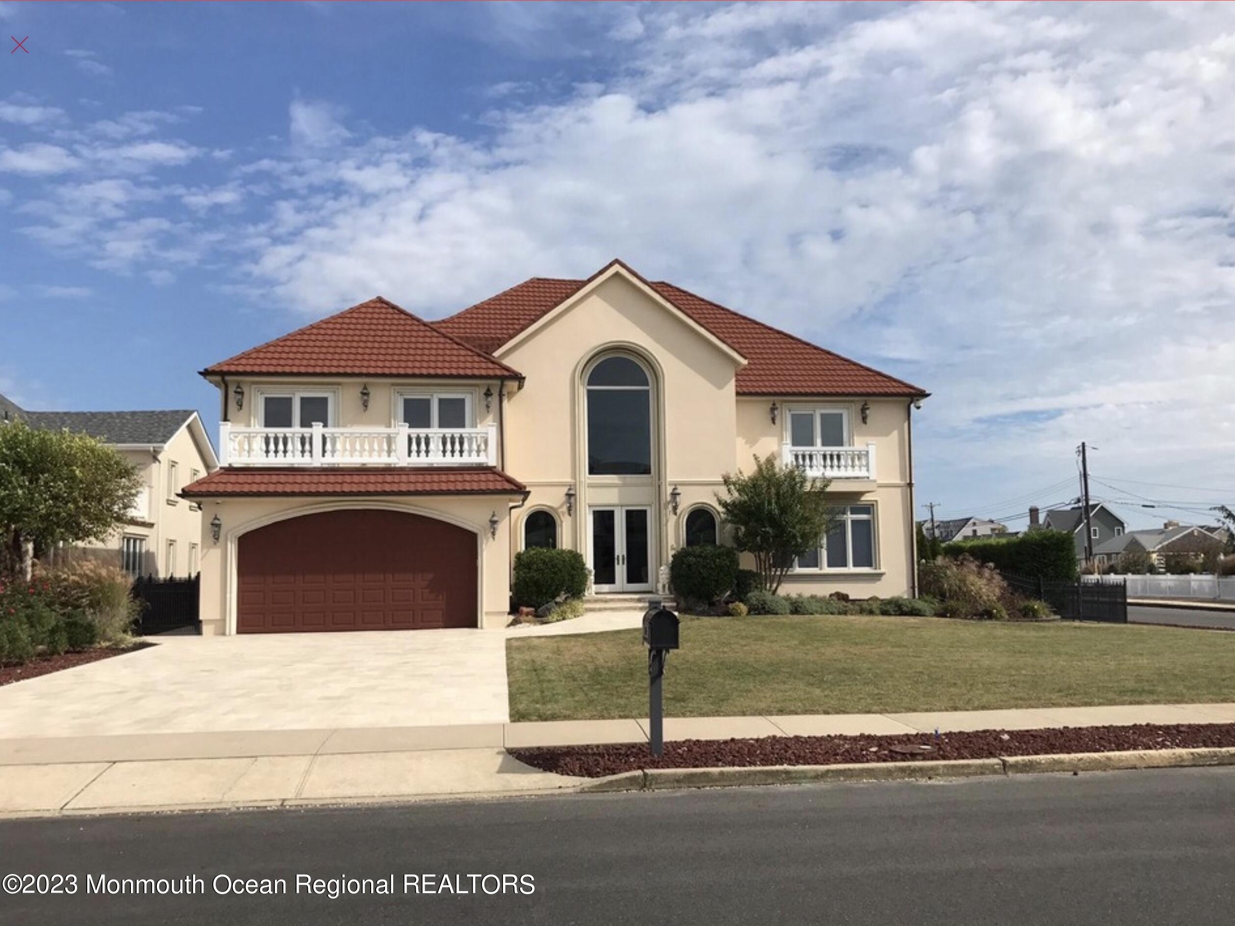 220 Pointe Drive Mantoloking, NJ 08738 - Photo 4 of 30 a front view of a house with a yard
