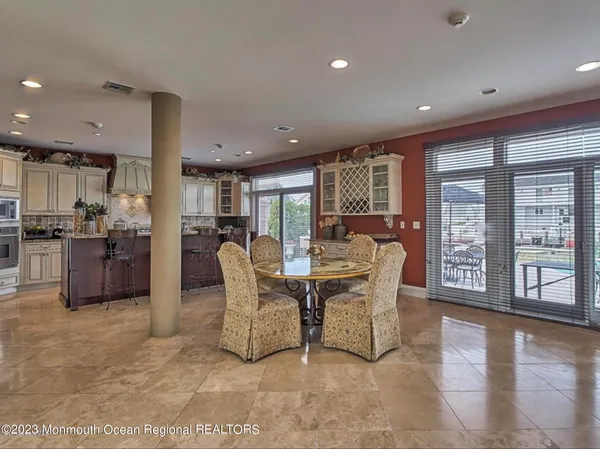 a view of a dining room with furniture window and outside view