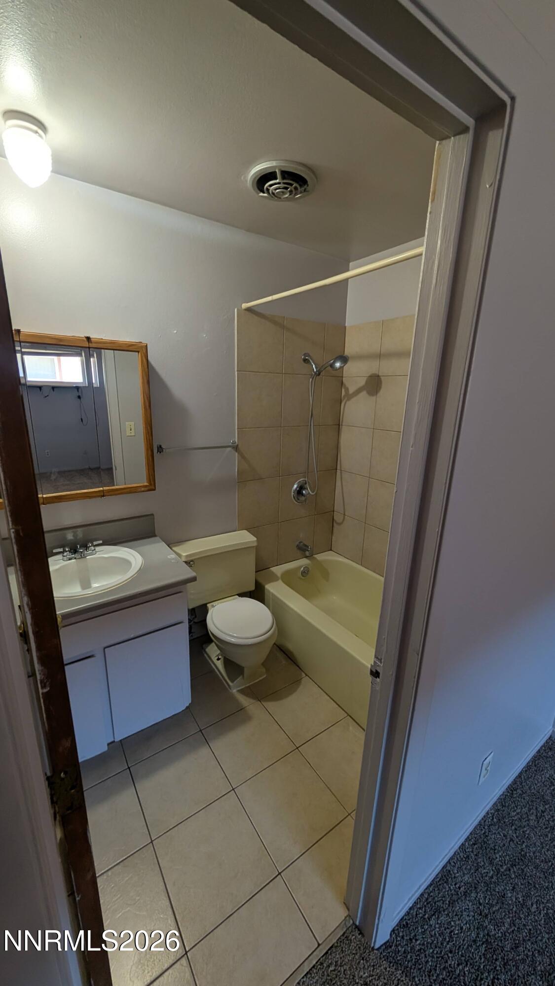 1312 Como Street Carson City, NV 89701 - Photo 4 of 5 a bathroom with a sink a toilet and shower