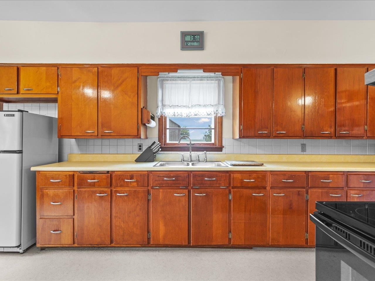 9311 State Line Road Capron, IL 61012 - Photo 26 of 51 a kitchen with wooden cabinets and a sink