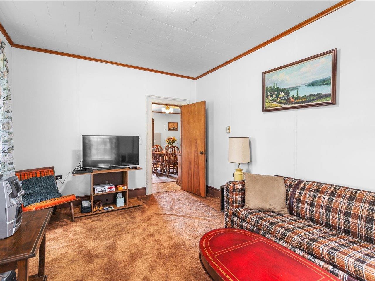 9311 State Line Road Capron, IL 61012 - Photo 40 of 51 a living room with furniture and a flat screen tv