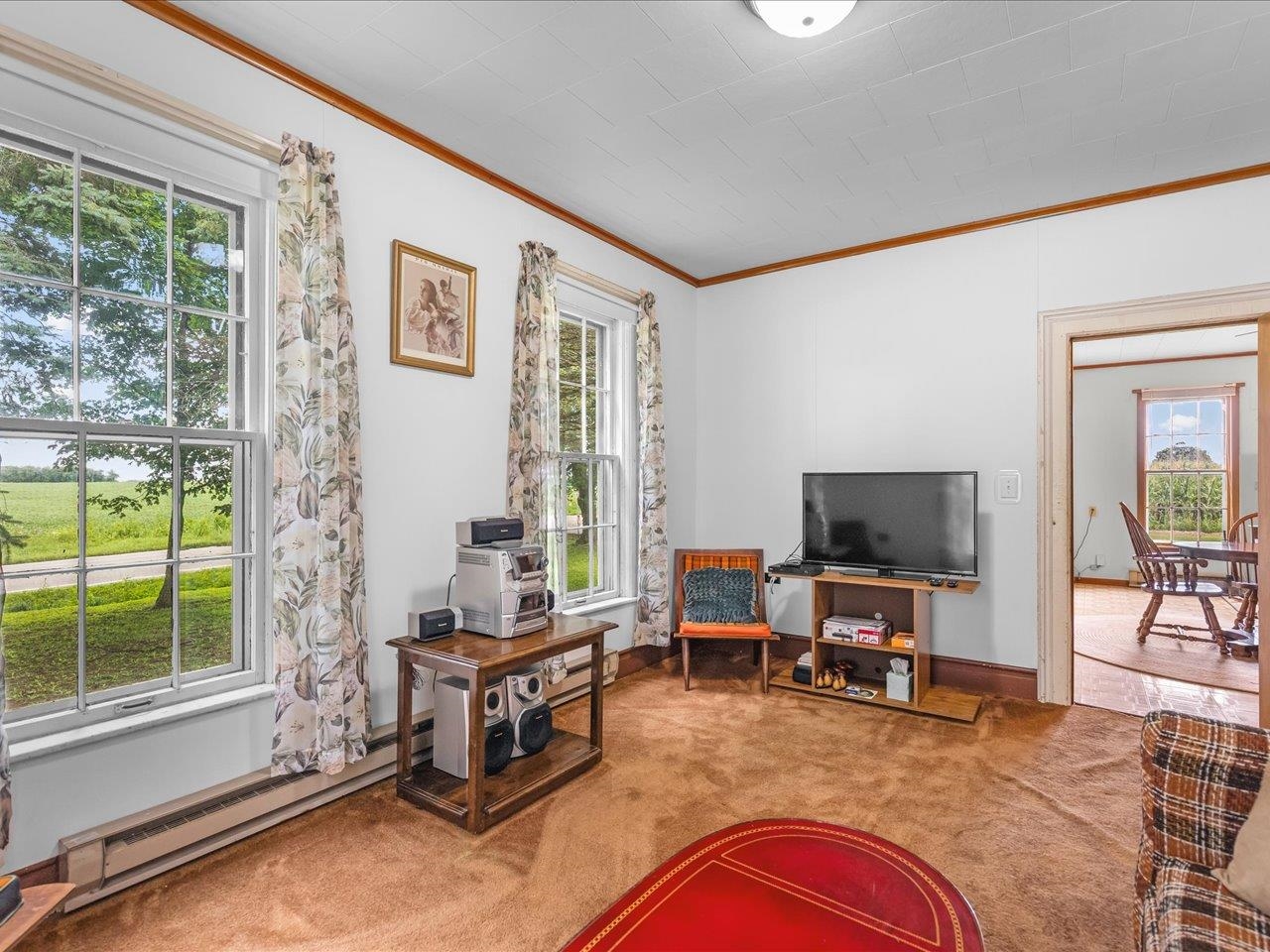 9311 State Line Road Capron, IL 61012 - Photo 41 of 51 a living room with furniture cabinets and a flat screen tv