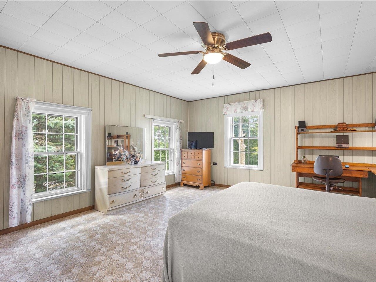 9311 State Line Road Capron, IL 61012 - Photo 43 of 51 a bedroom with a large bed and a large window