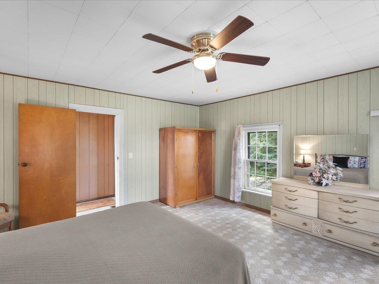 9311 State Line Road Capron, IL 61012 - Photo 45 of 51 a large bedroom with a bed and a large window