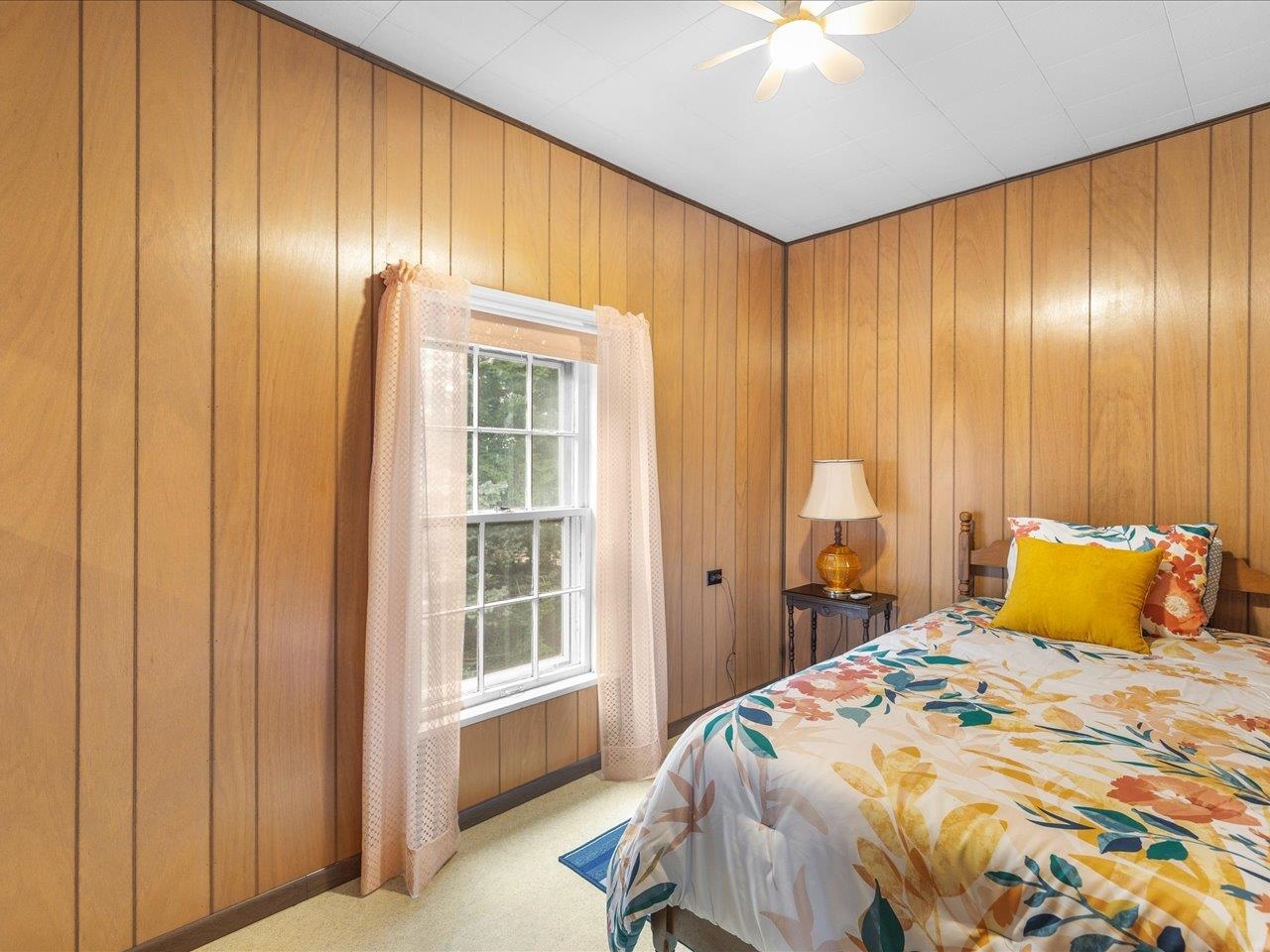 9311 State Line Road Capron, IL 61012 - Photo 48 of 51 a bedroom with a bed and a chandelier
