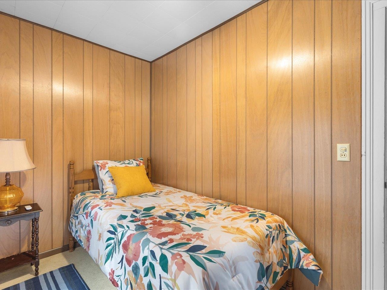 9311 State Line Road Capron, IL 61012 - Photo 49 of 51 a bedroom with a bed and a curtain
