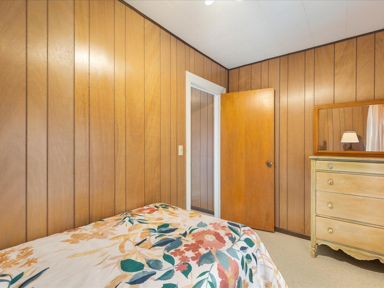 9311 State Line Road Capron, IL 61012 - Photo 50 of 51 a bedroom with a bed and a mirror