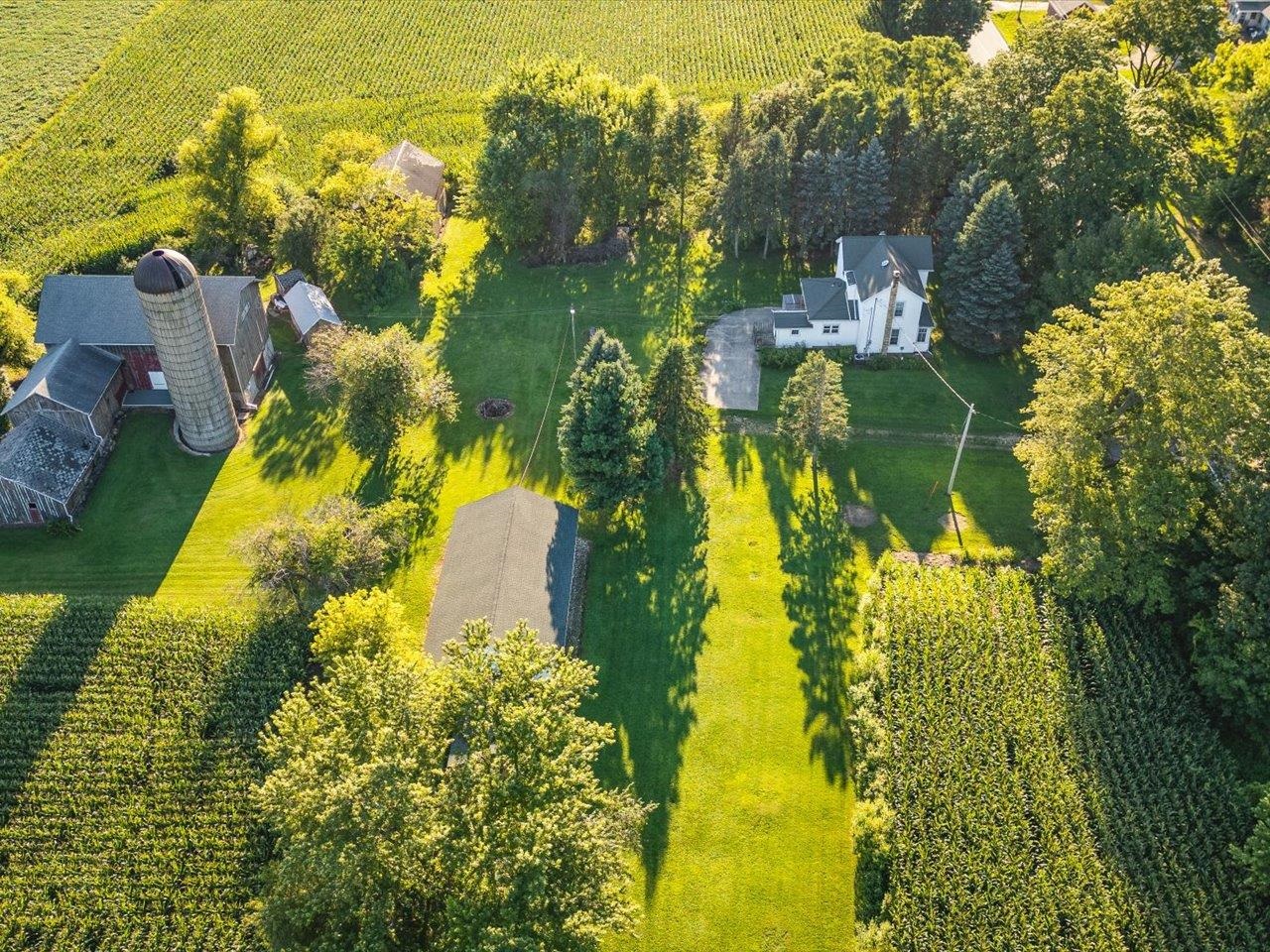 9311 State Line Road Capron, IL 61012 - Photo 9 of 51 a aerial view of a residential houses with yard