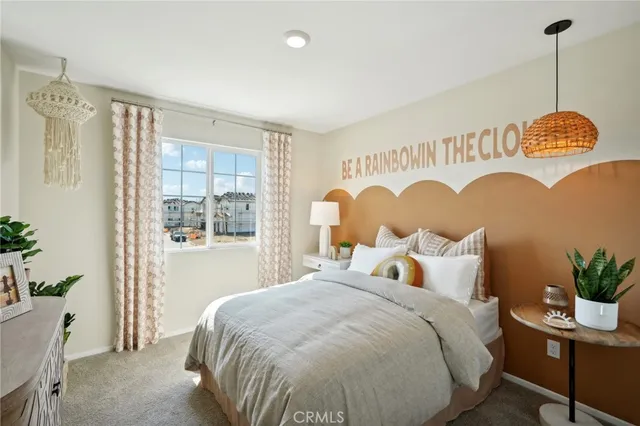 a bedroom with a bed and a table in it