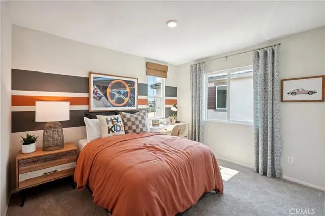 a bedroom with a bed and a night stand